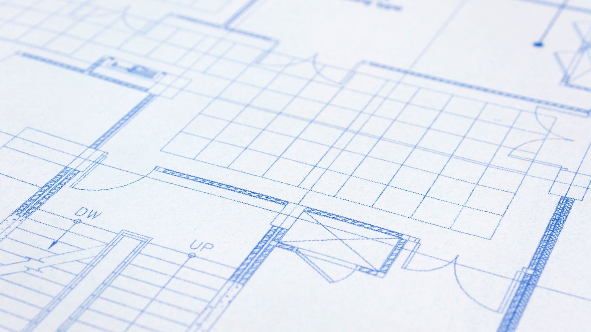 Architectural blueprint with blue lines showing floor plan details